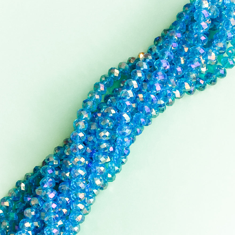 
                
                    Load image into Gallery viewer, 10mm Mermaid Blue Faceted Crystal Rondelle Strand
                
            