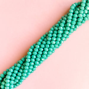 
                
                    Load image into Gallery viewer, 8mm Opaque Turquoise Faceted Crystal Rondelle Strand
                
            
