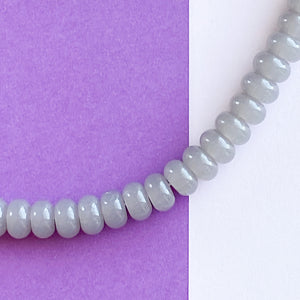 
                
                    Load image into Gallery viewer, 8mm Translucent Gray Glass Rondelle Strand
                
            