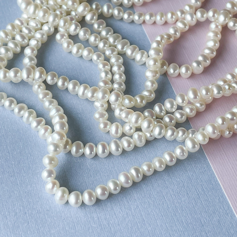 
                
                    Load image into Gallery viewer, 5mm White Freshwater Pearl Round Strand
                
            