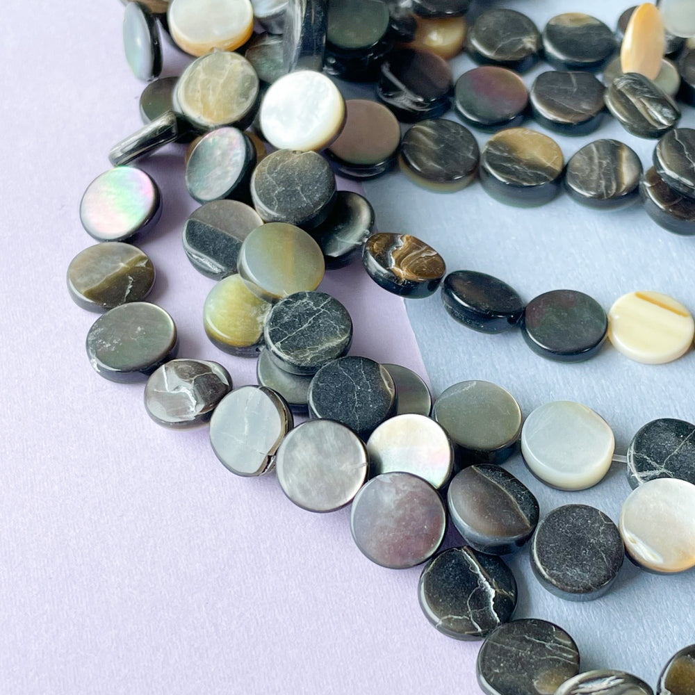 
                
                    Load image into Gallery viewer, 9mm Black Mother Of Pearl Coin Strand
                
            