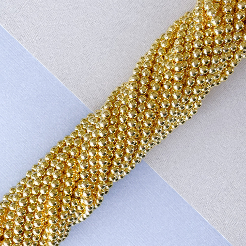 
                
                    Load image into Gallery viewer, 4mm Gold Hematite Rounds Strand
                
            