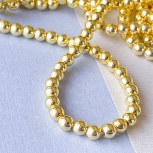 
                
                    Load image into Gallery viewer, 4mm Gold Hematite Rounds Strand
                
            
