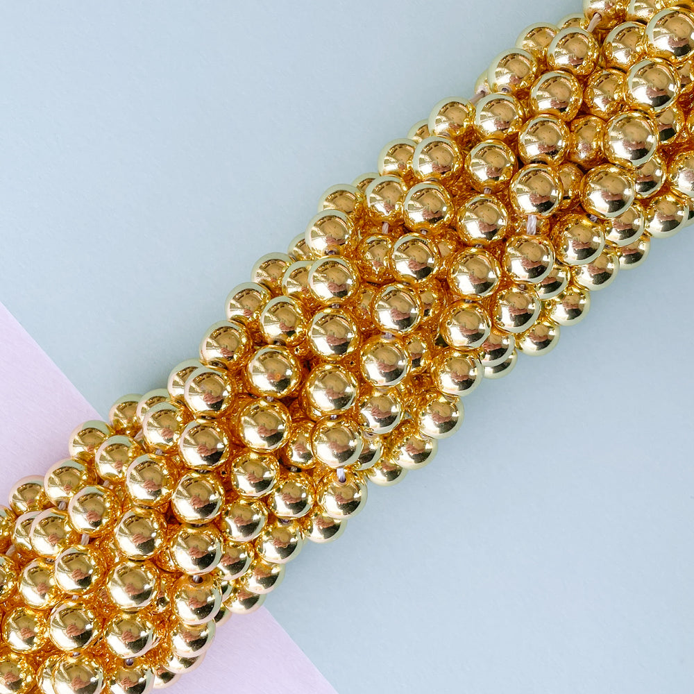 
                
                    Load image into Gallery viewer, 8mm Gold Hematite Rounds Strand
                
            