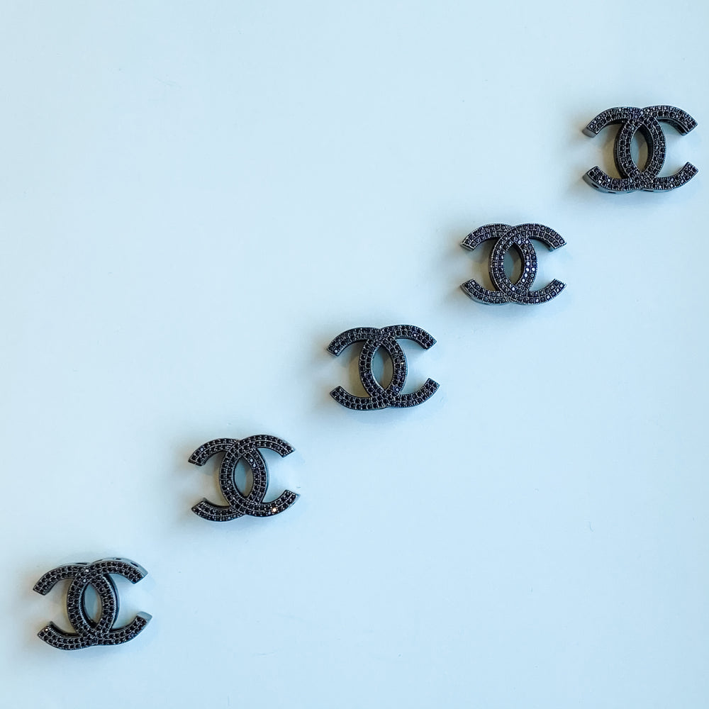 
                
                    Load image into Gallery viewer, 19mm Black Pave Interlocking C Bead
                
            