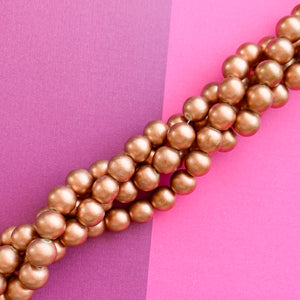 
                
                    Load image into Gallery viewer, 12mm Rose Gold Wood Rounds Strand
                
            
