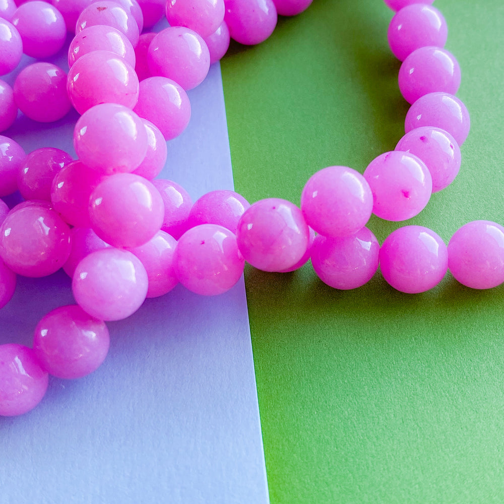 
                
                    Load image into Gallery viewer, 8mm Bubblegum Jade Rounds Strand
                
            