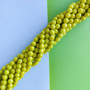 
                
                    Load image into Gallery viewer, 8mm Chartreuse Green Jade Rounds Strand
                
            