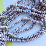 8mm Cookies And Cream Spotted Jade Faceted Rondelle Strand