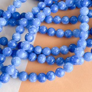 
                
                    Load image into Gallery viewer, 8mm Royal Blue Dyed Jade Rounds Strand
                
            