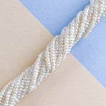 2mm Button Seed Freshwater Pearl Strand