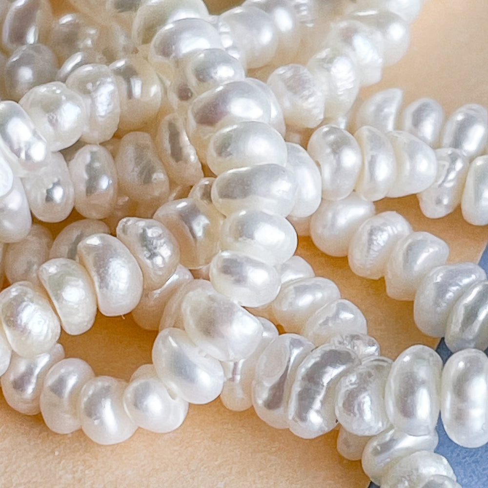 2mm Button Seed Freshwater Pearl Strand