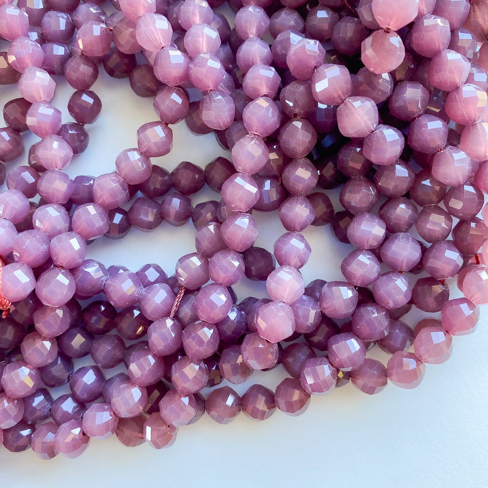 
                
                    Load image into Gallery viewer, 8mm Fancy Helix Cut Purple Crystal Rounds Strand
                
            