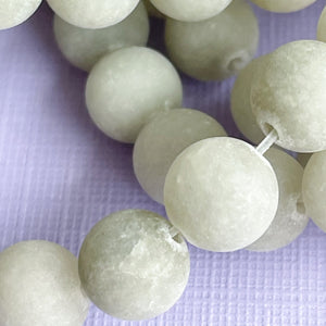 
                
                    Load image into Gallery viewer, 8mm Matte Ecru Dyed Jade Rounds Strand
                
            