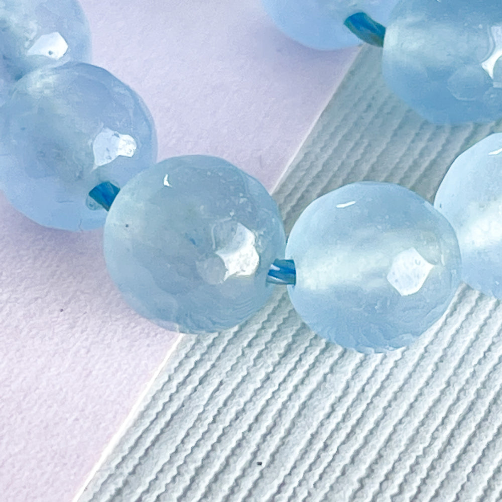
                
                    Load image into Gallery viewer, 8mm Faceted Translucent Sky Blue Dyed Jade Rounds Strand
                
            