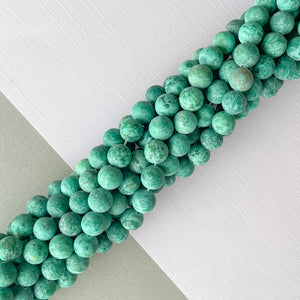 
                
                    Load image into Gallery viewer, 8mm Matte Pine Spotted Jade Rounds Strand
                
            