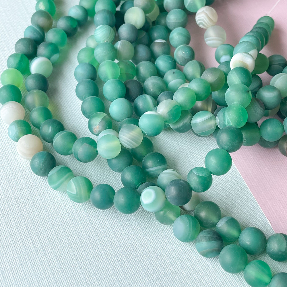 
                
                    Load image into Gallery viewer, 8mm Matte Spearmint Banded Agate Rounds Strand
                
            