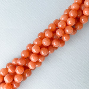 
                
                    Load image into Gallery viewer, 10mm Nectarine Dyed Jade Rounds Strand
                
            