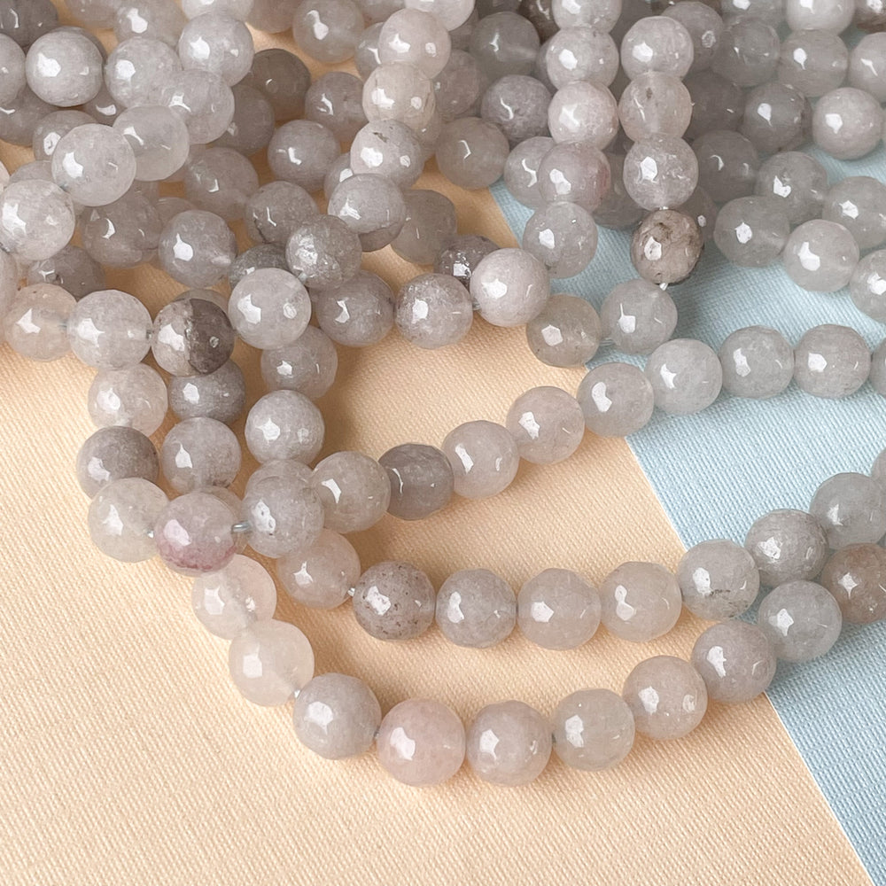 
                
                    Load image into Gallery viewer, 8mm Cloudy Gray Faceted Dyed Jade Rounds Strand
                
            