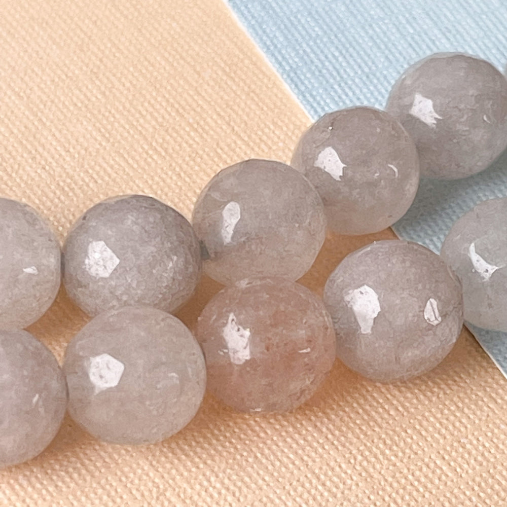 
                
                    Load image into Gallery viewer, 8mm Cloudy Gray Faceted Dyed Jade Rounds Strand
                
            