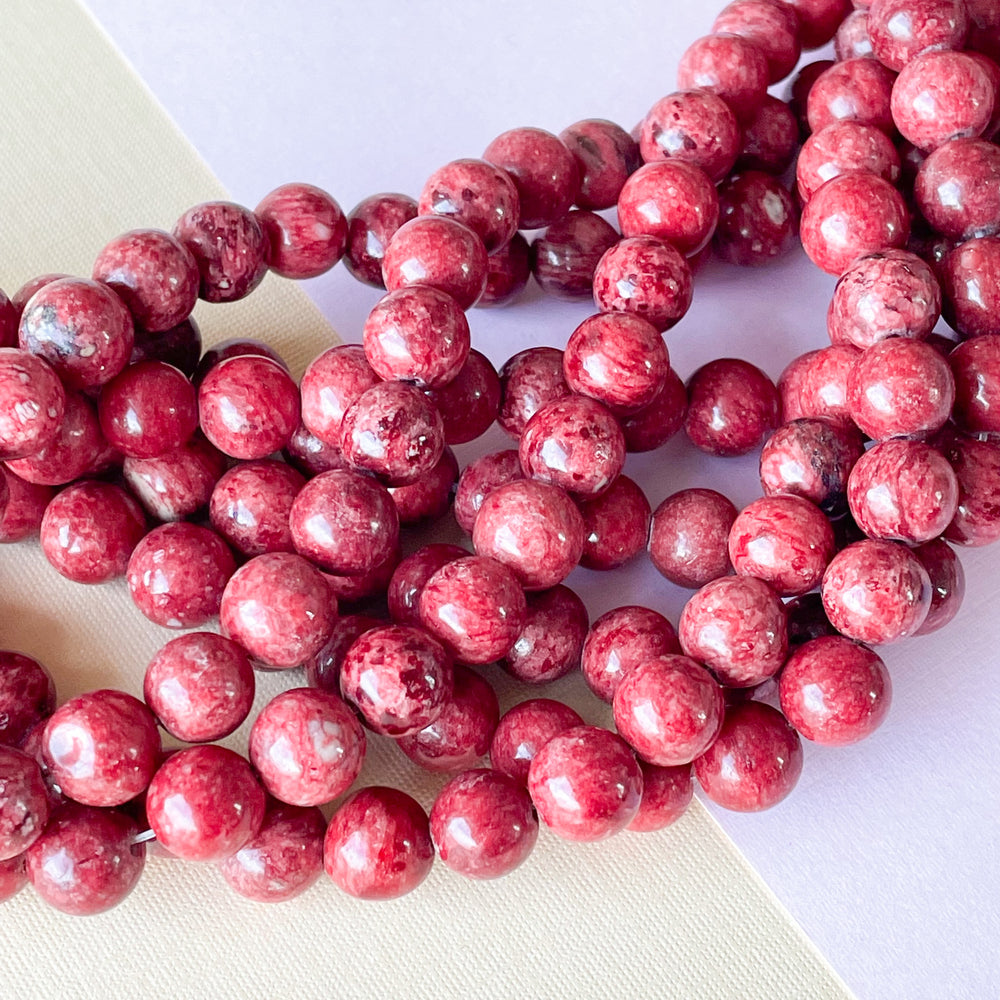 8mm Rust Red Spotted Jade Rounds Strand
