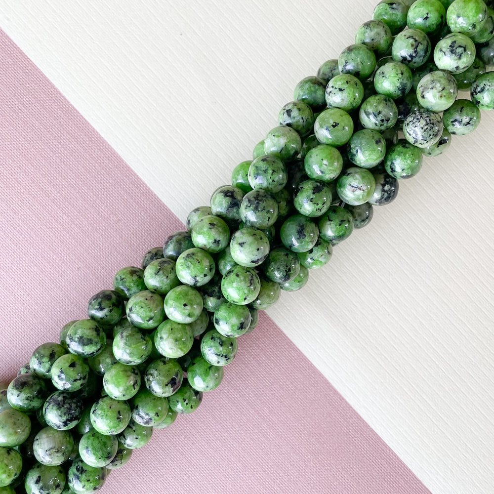 
                
                    Load image into Gallery viewer, 8mm Fern Green Spotted Jade Rounds Strand
                
            