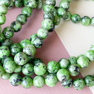 
                
                    Load image into Gallery viewer, 8mm Fern Green Spotted Jade Rounds Strand
                
            