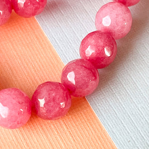
                
                    Load image into Gallery viewer, 8mm Faceted Berry Dyed Jade Rounds Strand
                
            