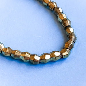 
                
                    Load image into Gallery viewer, 5mm Gold Faceted Bicone Strand
                
            