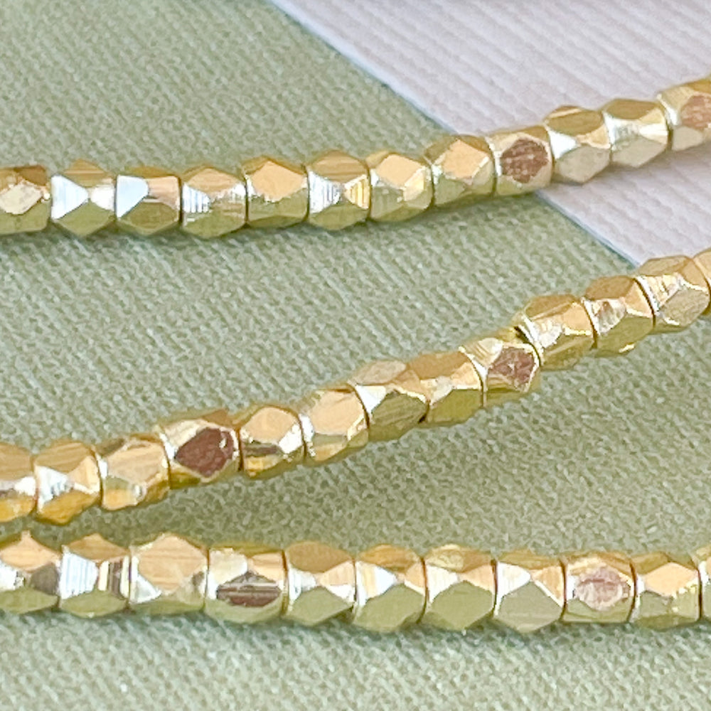 2mm Gold Faceted Nugget Strand