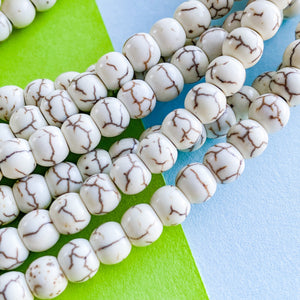 
                
                    Load image into Gallery viewer, 6mm Cream Magnesite Rounds Strand
                
            