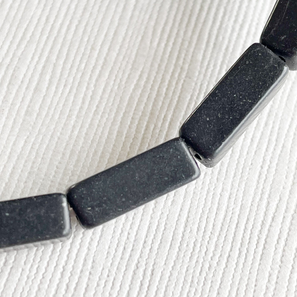 
                
                    Load image into Gallery viewer, 14mm Black Rectangular Magnesite Strand
                
            