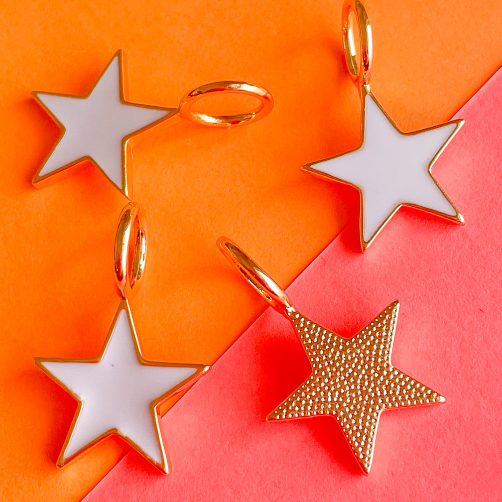 
                
                    Load image into Gallery viewer, 15mm White Enamel Gold Star Pendant
                
            