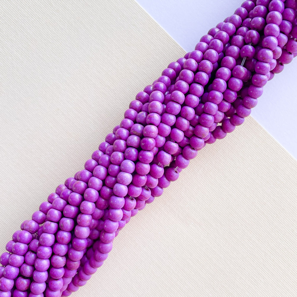 
                
                    Load image into Gallery viewer, 4mm Purple Magnesite Rounds Strand
                
            