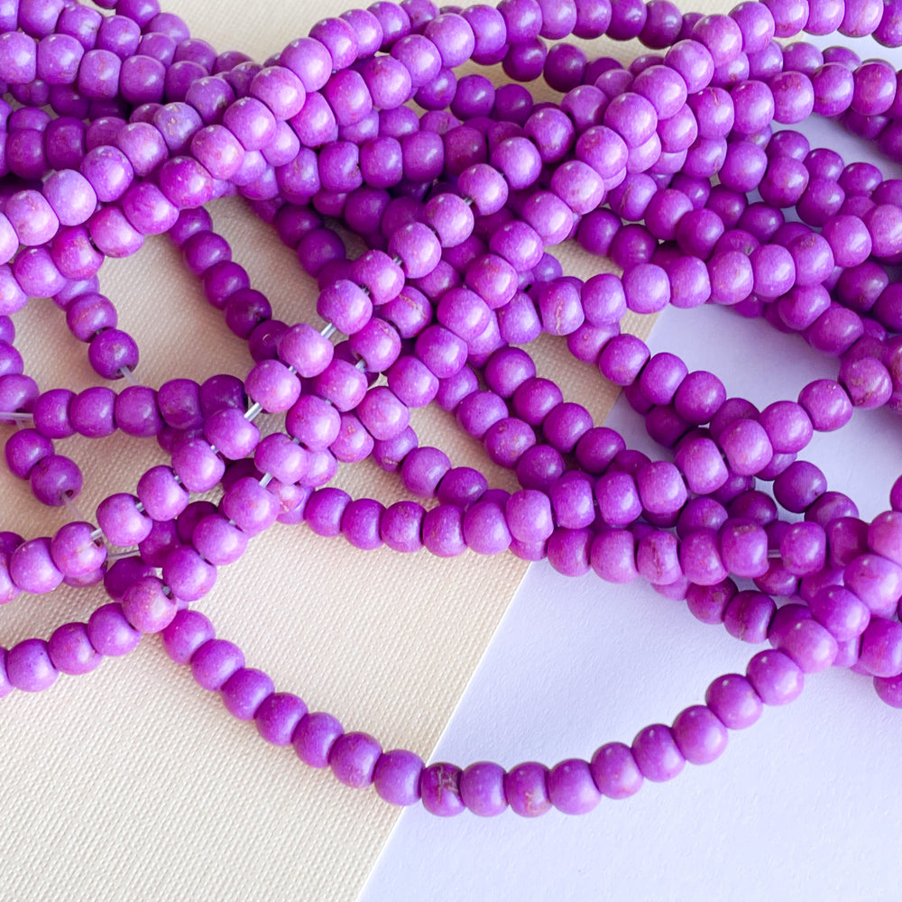 
                
                    Load image into Gallery viewer, 4mm Purple Magnesite Rounds Strand
                
            
