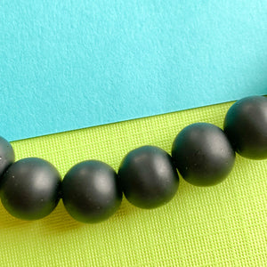 
                
                    Load image into Gallery viewer, 10mm Matte Black Onyx Round Strand
                
            