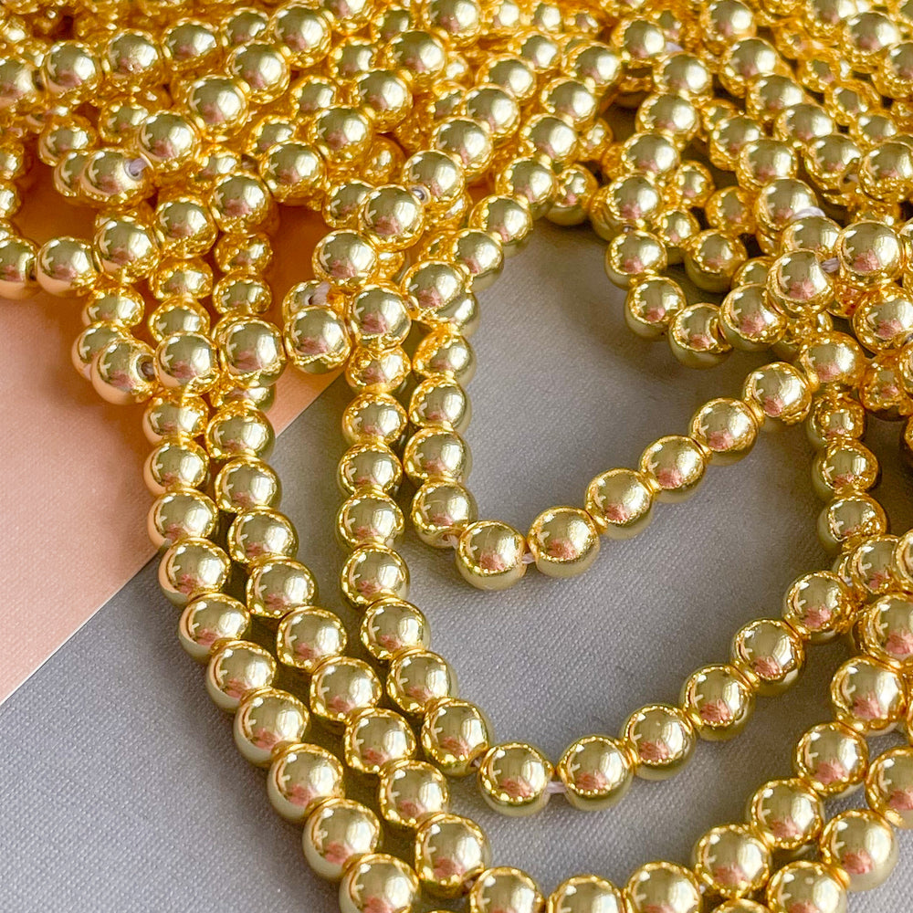 6mm Gold Hematite Rounds Strand – Beads, Inc.
