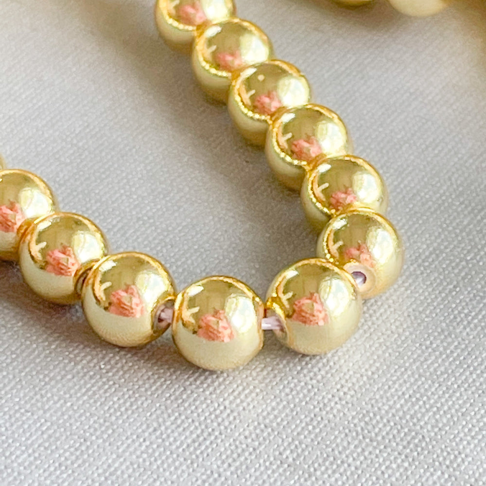 
                
                    Load image into Gallery viewer, 6mm Gold Hematite Rounds Strand
                
            