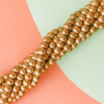 8mm Gold Wood Rounds Strand