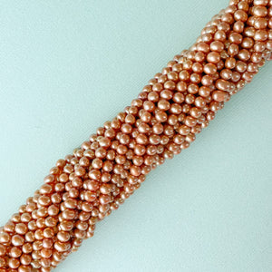 
                
                    Load image into Gallery viewer, 4mm Caramel Freshwater Pearl Rounds Strand
                
            