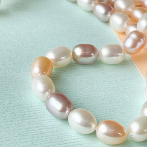 
                
                    Load image into Gallery viewer, 5mm Variegated Blush Oval Freshwater Pearl Strand
                
            