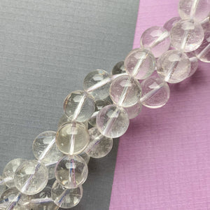 
                
                    Load image into Gallery viewer, 12mm Crystalline Natural Quartz Rounds Strand
                
            