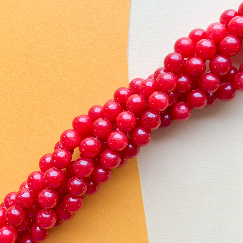 6mm Smooth Red Dyed Jade Rounds Strand