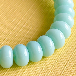 
                
                    Load image into Gallery viewer, 8mm Aqua Glass Rondelle Strand
                
            