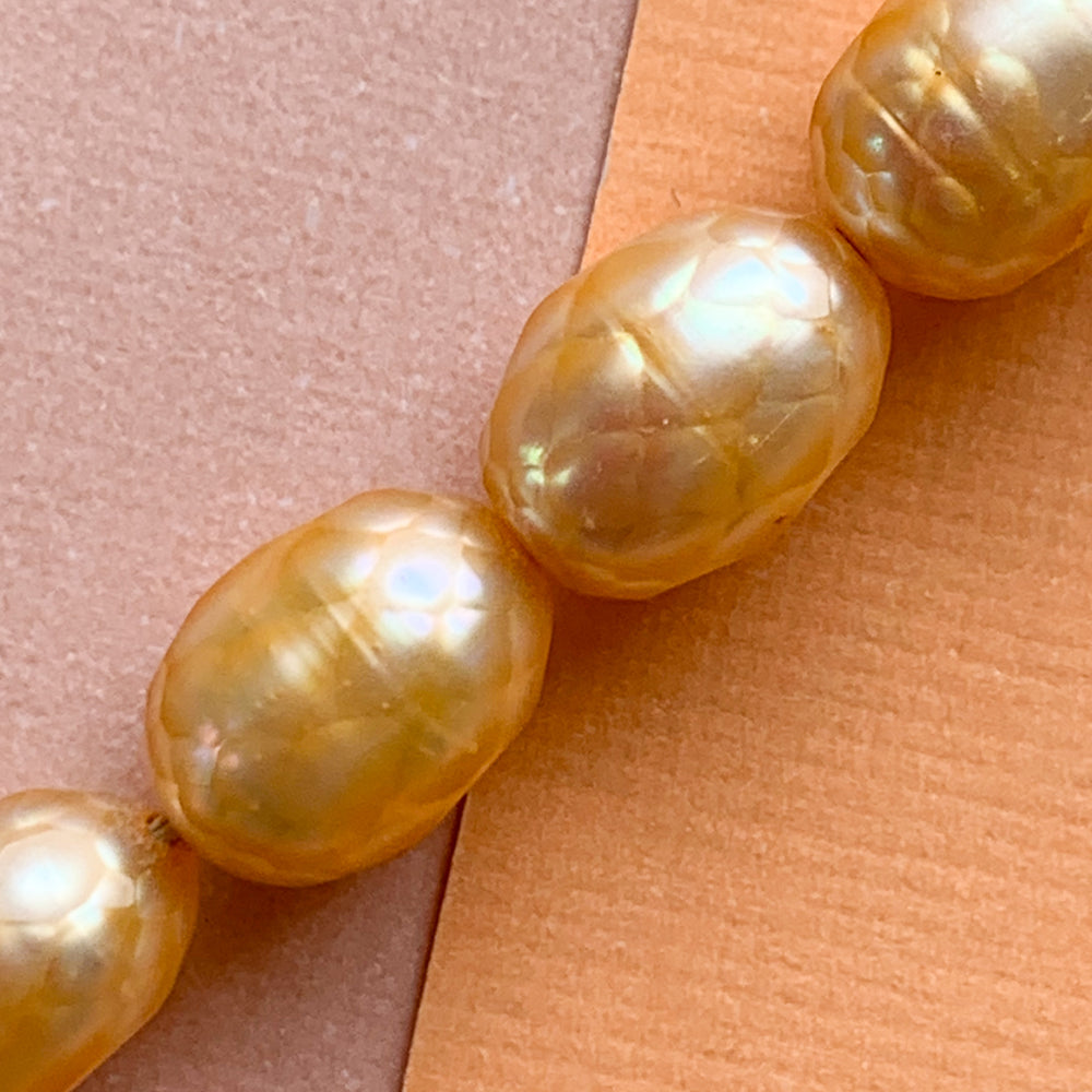 
                
                    Load image into Gallery viewer, 7mm Faceted Tangerine Freshwater Rice Pearl Strand
                
            