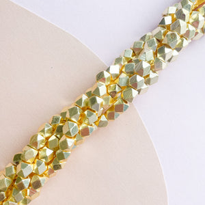 
                
                    Load image into Gallery viewer, 6mm Gold Faceted Nugget Strand
                
            