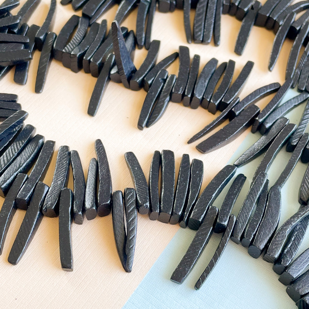 22-28mm Midnight Wood Spike Strand - Beads, Inc.