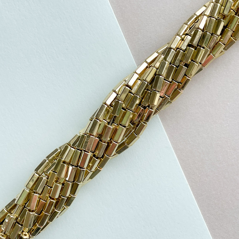 
                
                    Load image into Gallery viewer, 3mm Shiny Gold Hematite Hex Cylinder Strand
                
            