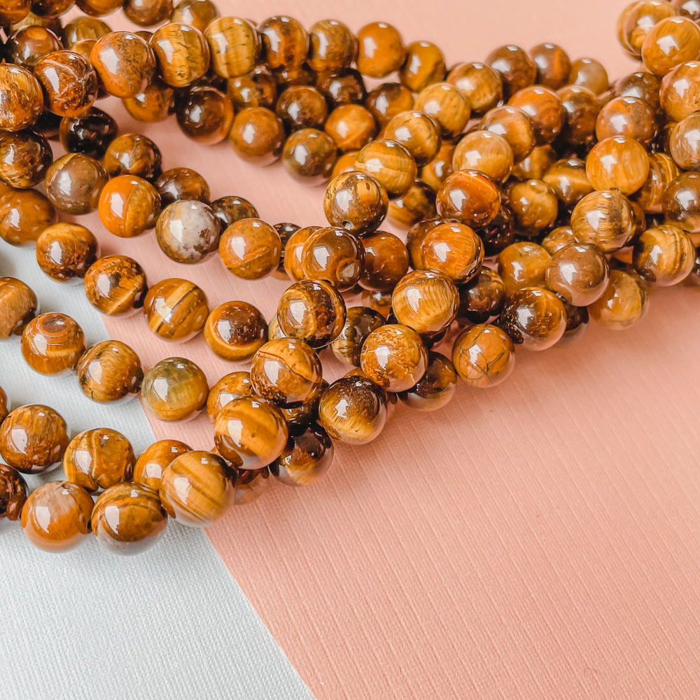 8mm Smooth Tigers Eye Rounds Strand - Christine White Style