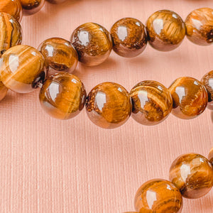 8mm Smooth Tigers Eye Rounds Strand - Christine White Style